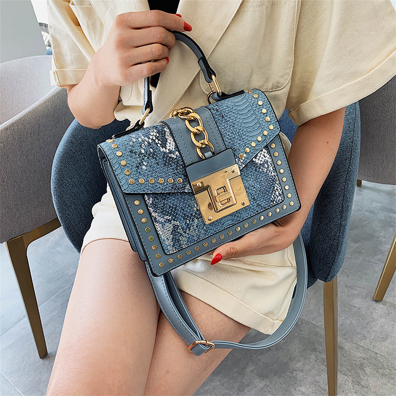 Fashion snake pattern handbag See size chart under “more details”