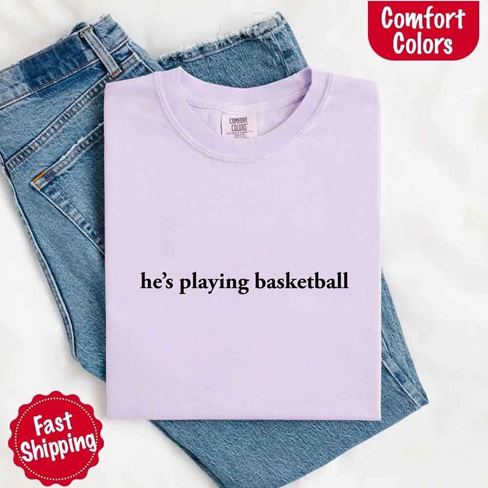 He’s Playing Basketball – Funny Sports Girlfriend Comfort Colors Shirt for Women