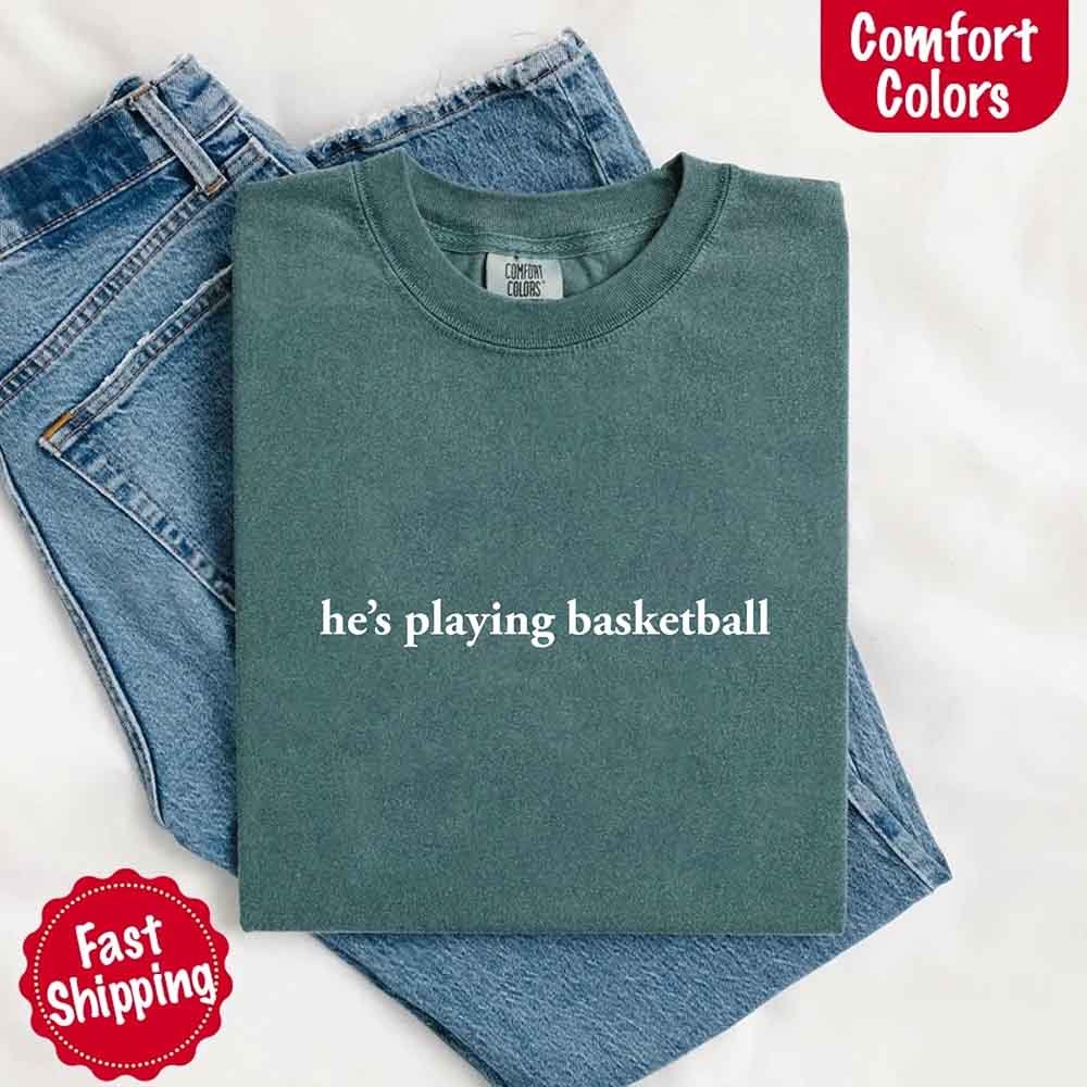 He’s Playing Basketball – Funny Sports Girlfriend Comfort Colors Shirt for Women