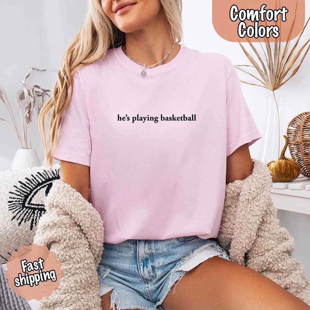 He’s Playing Basketball – Funny Sports Girlfriend Comfort Colors Shirt for Women