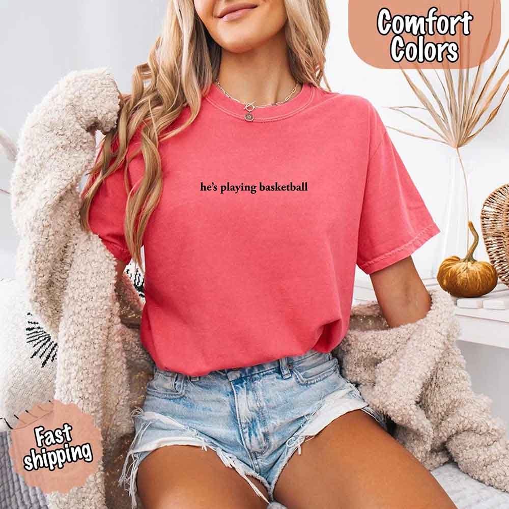 He’s Playing Basketball – Funny Sports Girlfriend Comfort Colors Shirt for Women
