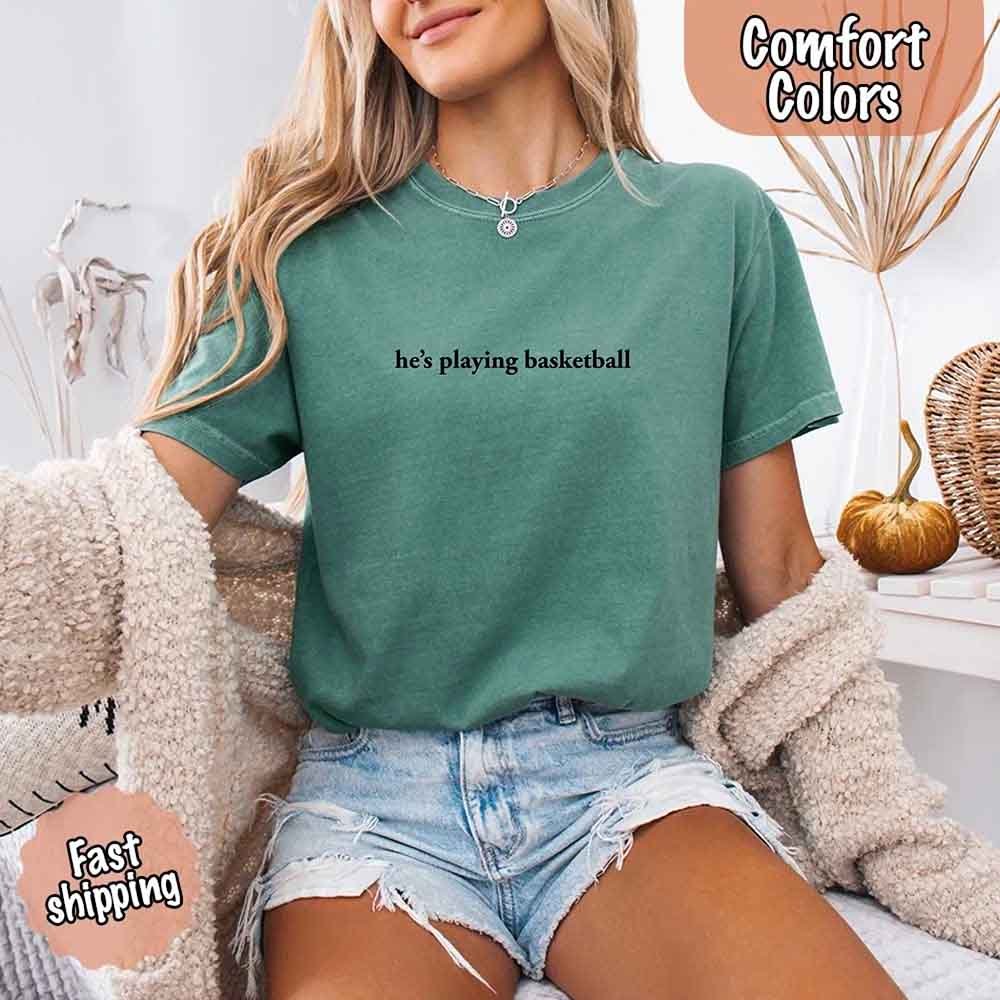 He’s Playing Basketball – Funny Sports Girlfriend Comfort Colors Shirt for Women