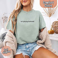 He’s Playing Basketball – Funny Sports Girlfriend Comfort Colors Shirt for Women