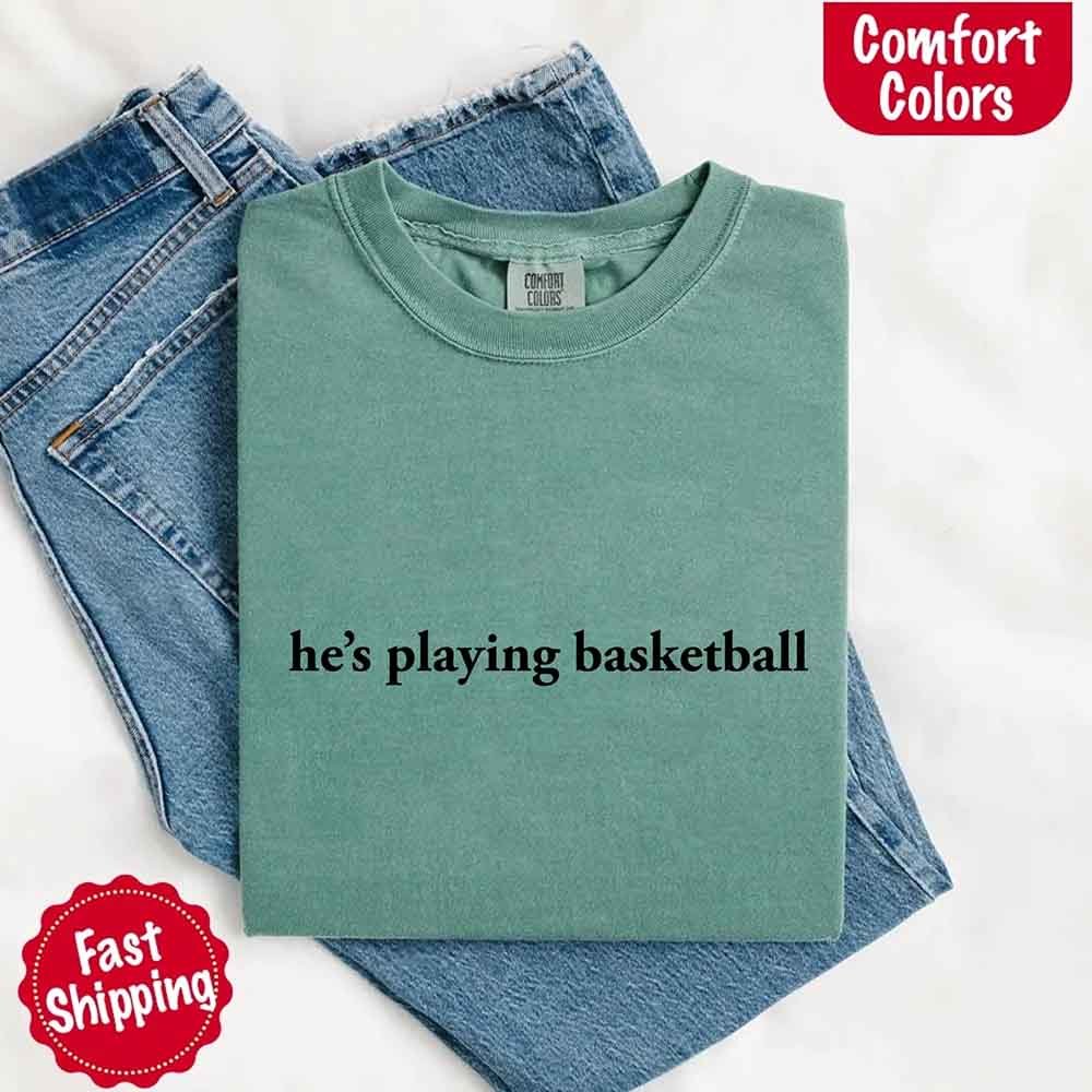 He’s Playing Basketball – Funny Sports Girlfriend Comfort Colors Shirt for Women