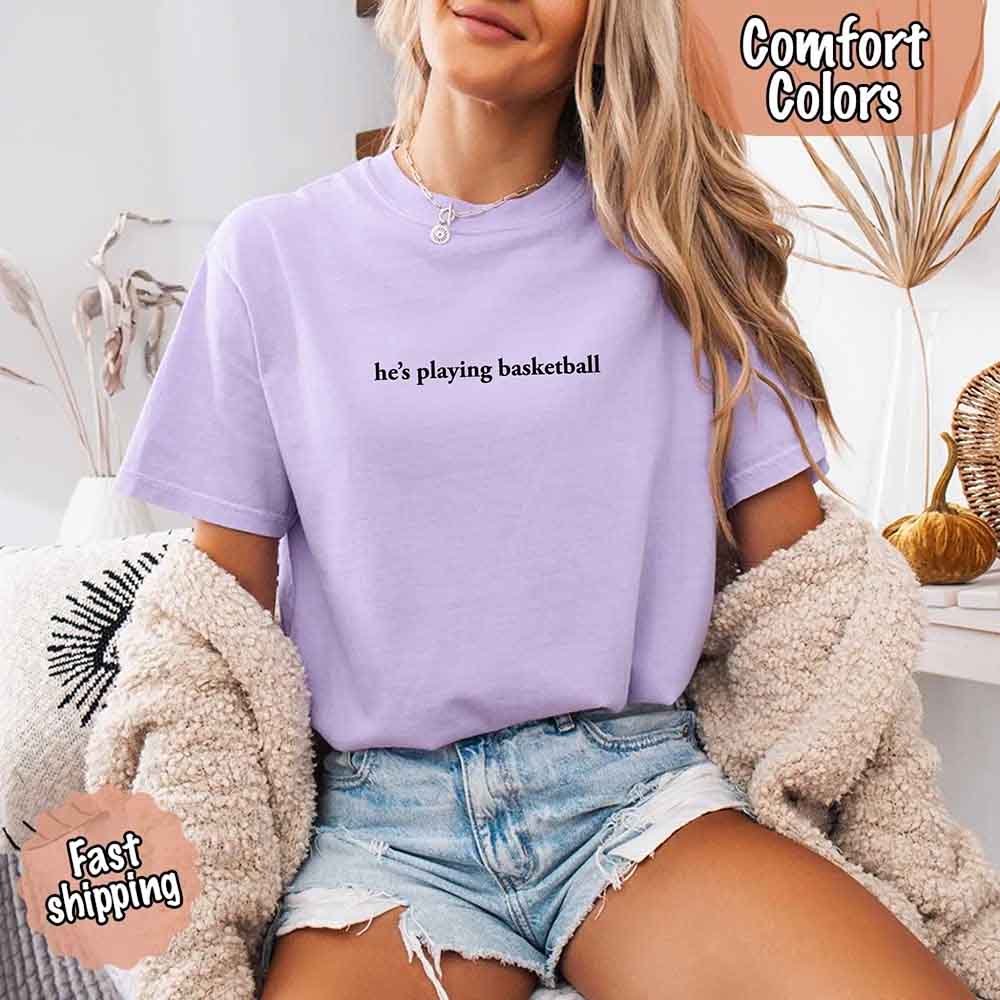 He’s Playing Basketball – Funny Sports Girlfriend Comfort Colors Shirt for Women