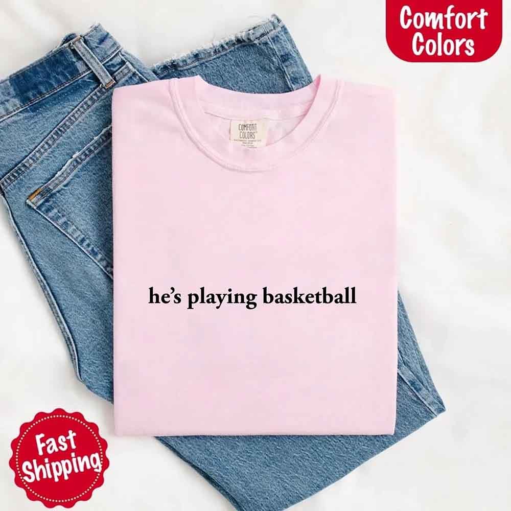 He’s Playing Basketball – Funny Sports Girlfriend Comfort Colors Shirt for Women